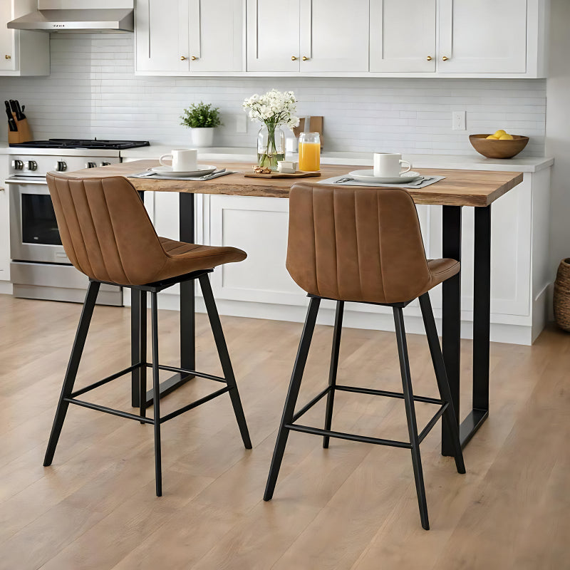 Kitchen with a wooden dining table and two brown bar stools.