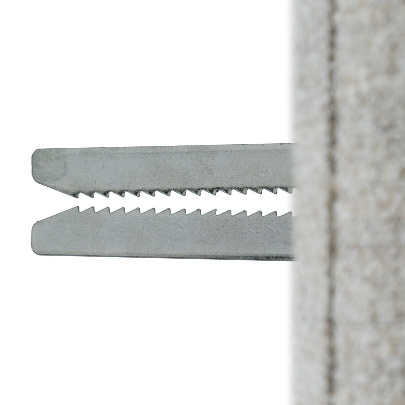 Metal zip tie against a white background