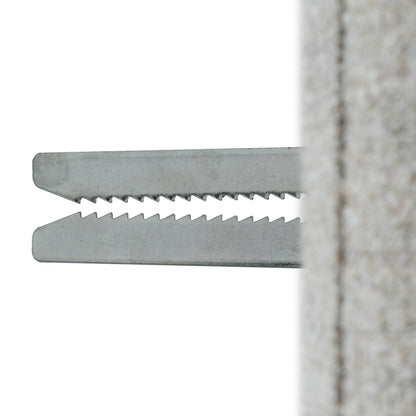 Metal zip tie against a white background