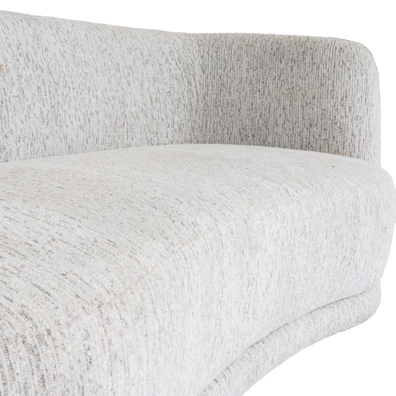 Close-up of a textured neutral sofa cushion on a white background