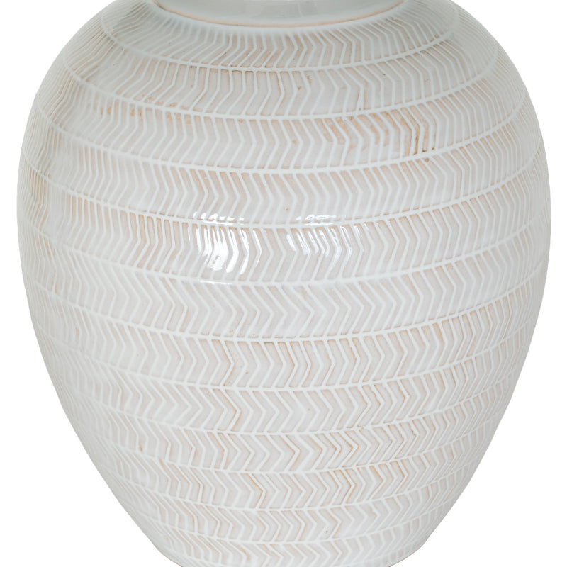 White ceramic vase with decorative pattern on a white background