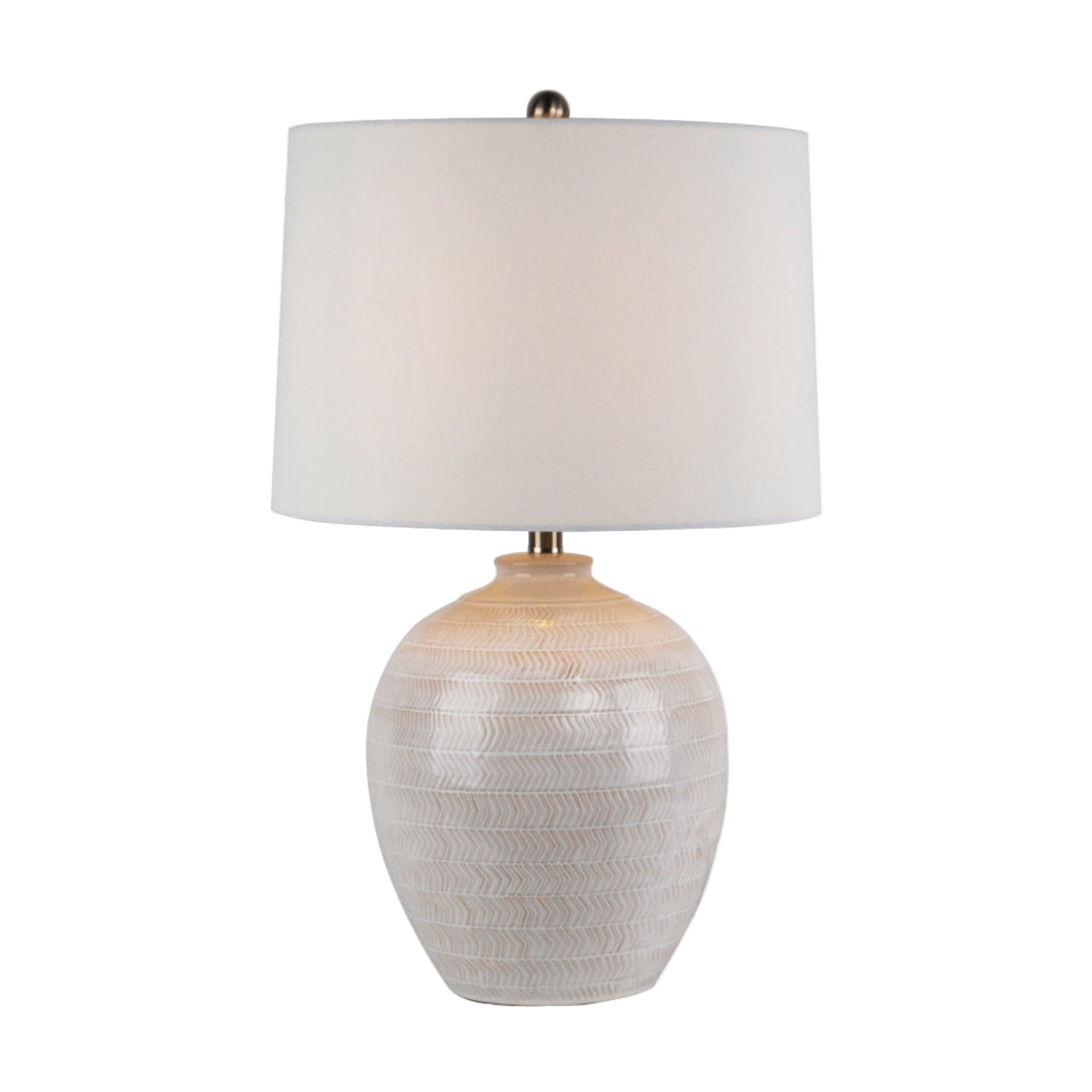 Table lamp with textured white base and white shade on a white background