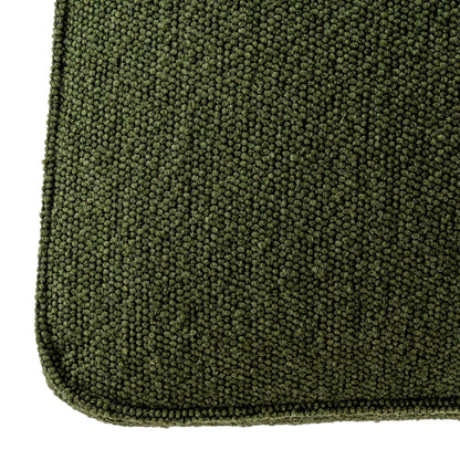 Close-up of a green textured rug on a white background