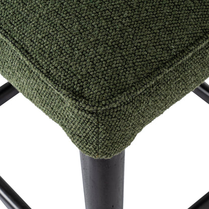 Close-up of a green textured stool with a white background
