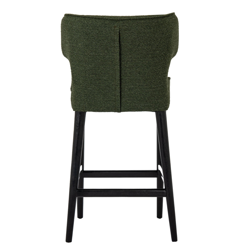 Green bar stool with black legs on a white background