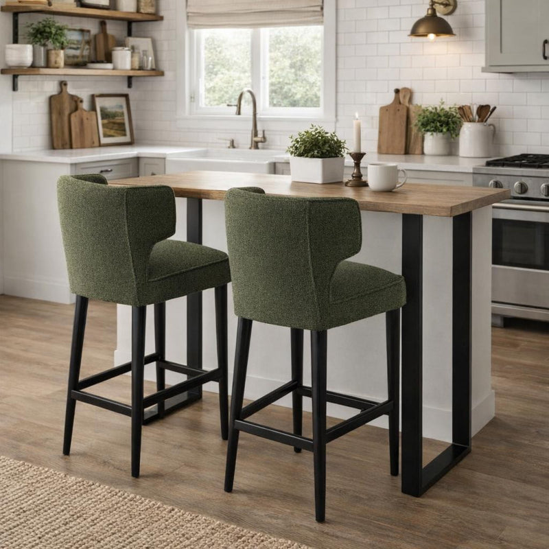 Kitchen with a wooden dining table and green bar stools.
