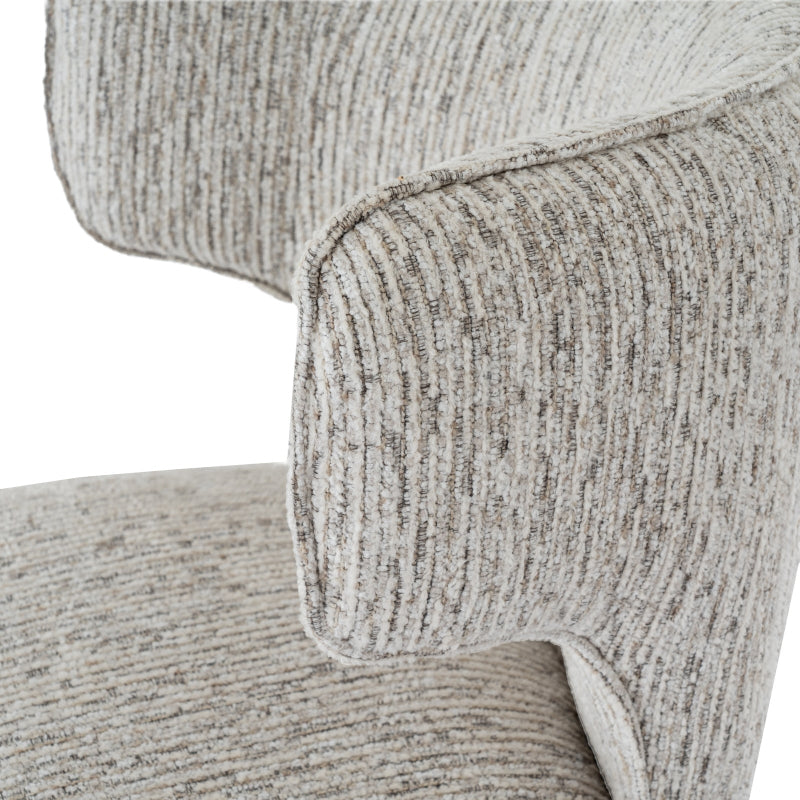 Close-up of a textured gray chair with a white background