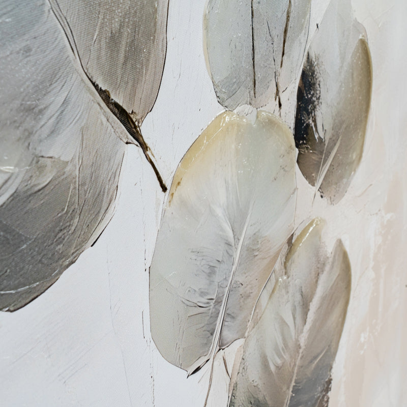 Close-up of feathered leaves on a textured white background