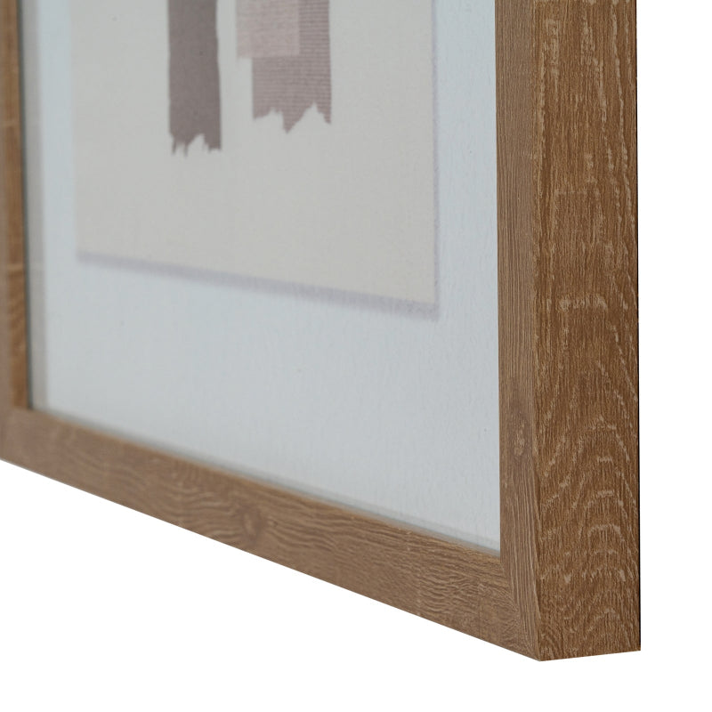 Close-up of a wooden picture frame with a blurred painting inside on a white background