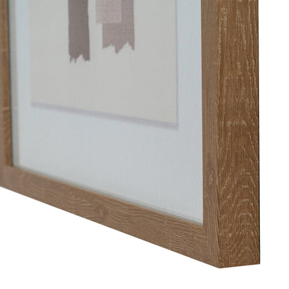 Close-up of a wooden picture frame with a blurred painting inside on a white background