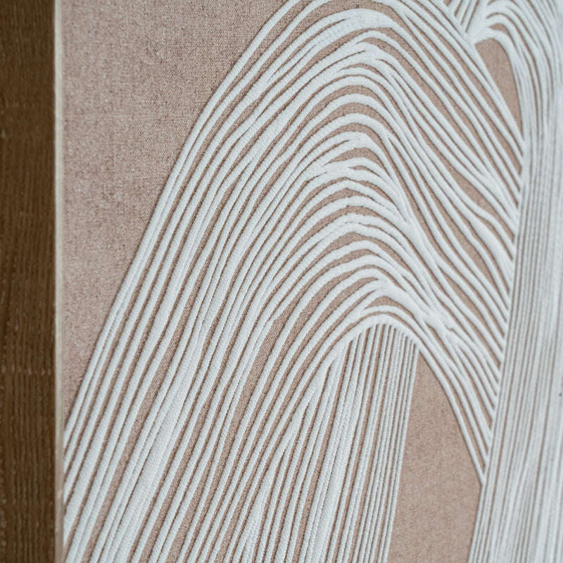 Close-up of a textured surface with wavy line pattern on a beige background