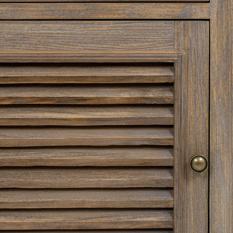 Close-up of a wooden door with horizontal slats and a brass handle.