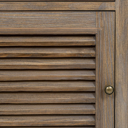 Close-up of a wooden door with horizontal slats and a brass handle.
