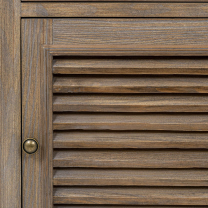 Close-up of a wooden door with horizontal slats and a brass handle.