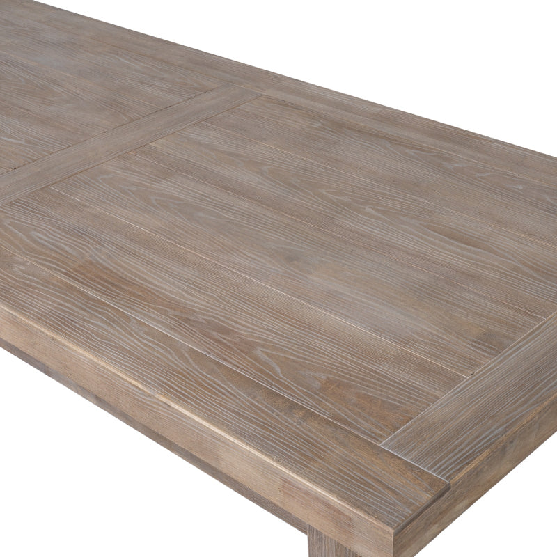 Close-up of a wooden table surface with a herringbone pattern on a white background
