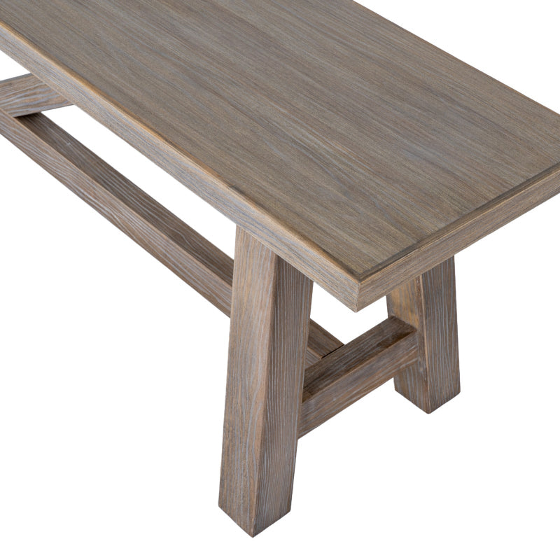 Wooden bench with a light brown finish on a white background