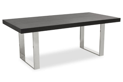 Rectangular table with dark surface and silver metal legs on a white background