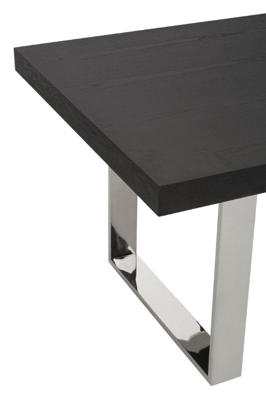 Black table with chrome legs on a white background