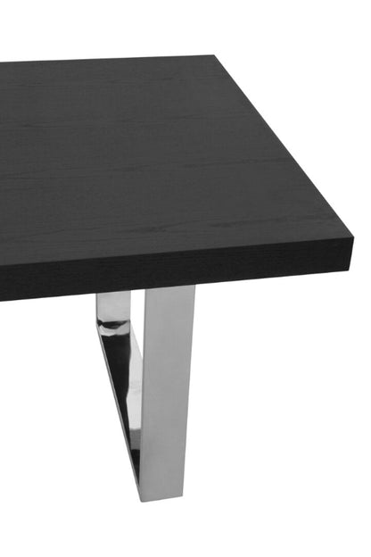 Black rectangular table with chrome legs on a white background