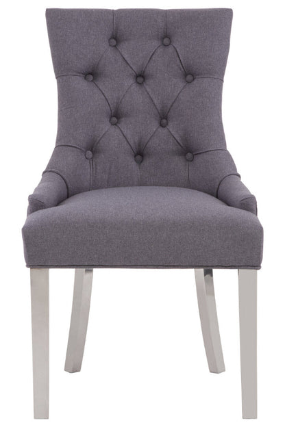 Gray upholstered chair with tufted backrest on a white background
