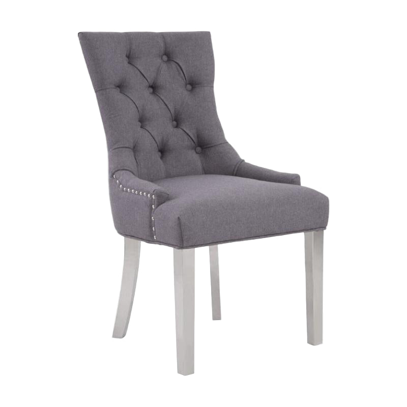 Gray upholstered chair with tufted backrest on a white background