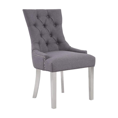 Gray upholstered chair with tufted backrest on a white background