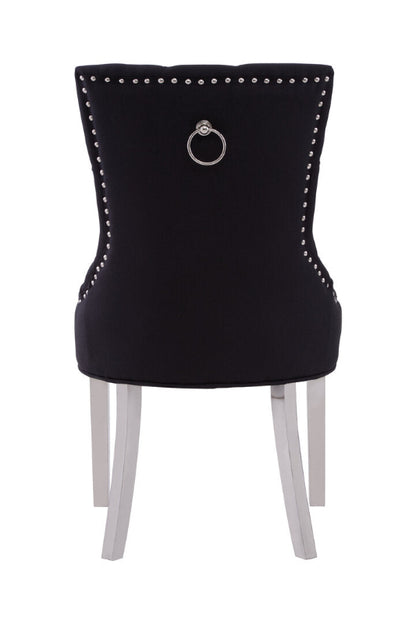 Black chair with silver studs and a ring on a white background
