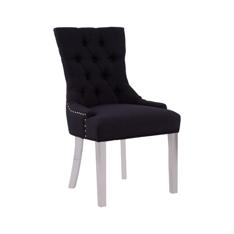 Black upholstered chair with silver nailhead trim on a white background
