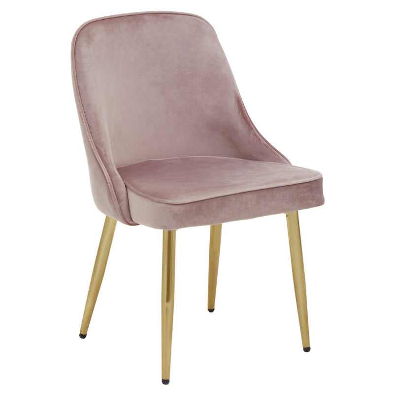 Pink velvet chair with gold legs on a white background