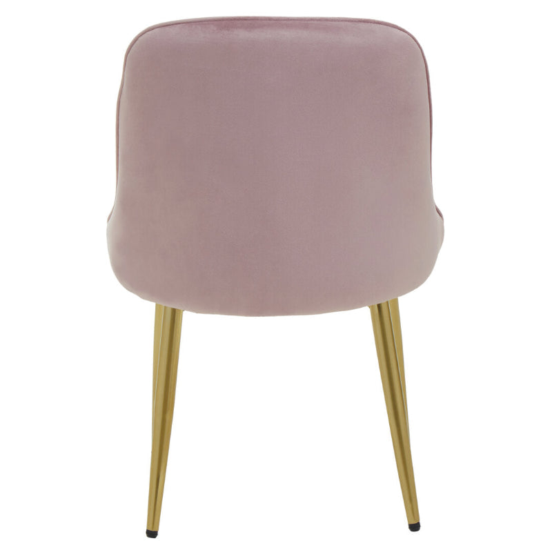 Pink velvet chair with gold legs on a white background