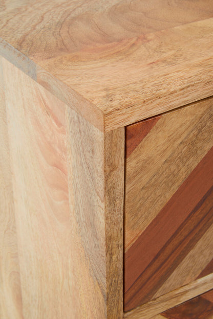 Close-up of a wooden cabinet with a focus on the corner and texture.