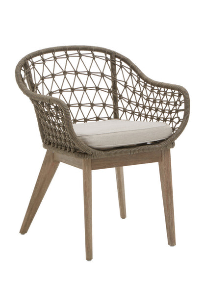 Brown woven chair with wooden legs on a white background