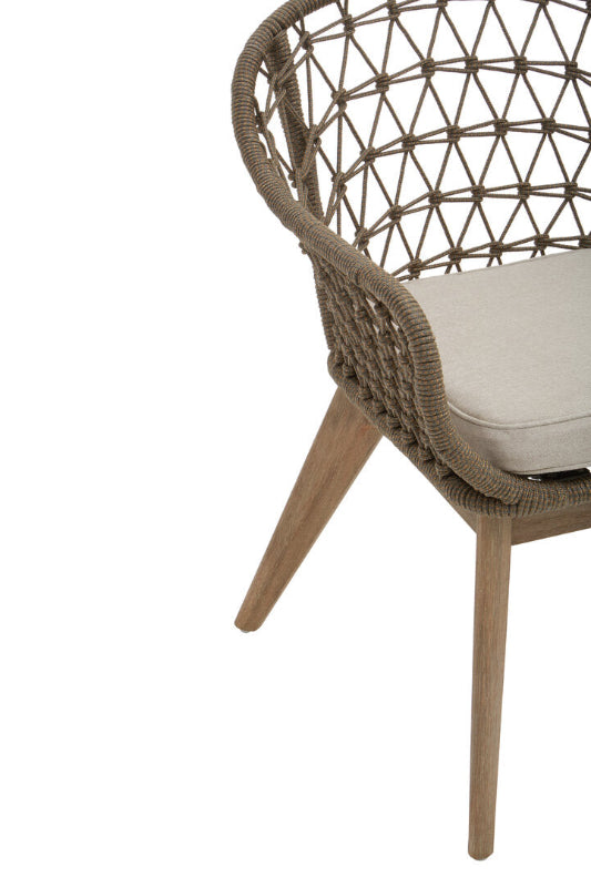 Wicker chair with a cushion on a white background