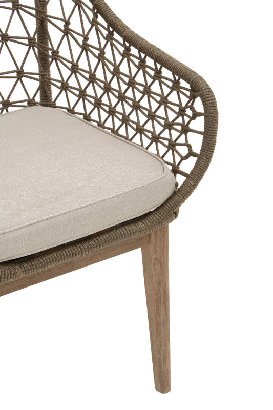 Wicker chair with a cushion on a white background