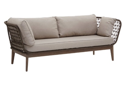 Beige outdoor sofa with wicker frame on a white background