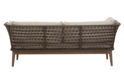 Wicker outdoor sofa with beige cushions on a white background