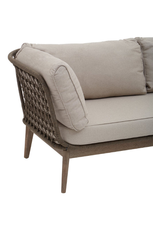 Beige outdoor sofa with wicker backrest on a white background