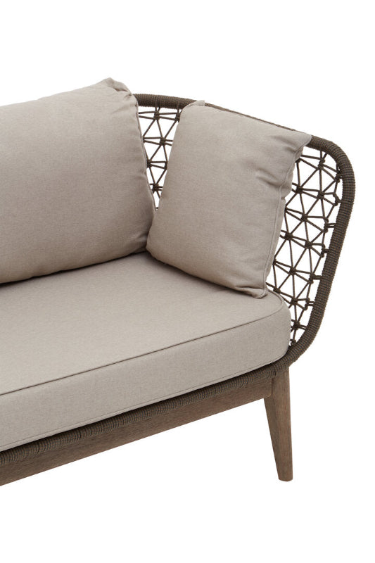 Beige outdoor sofa with woven backrest on a white background