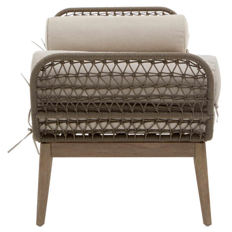 Wicker chair with beige cushion on a white background