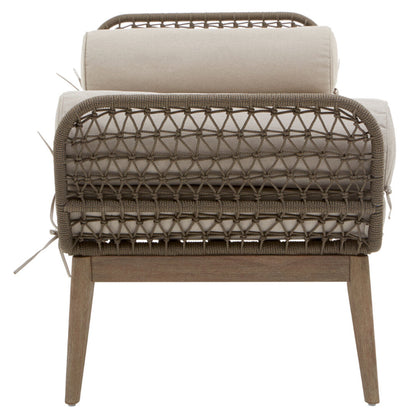 Wicker chair with beige cushion on a white background