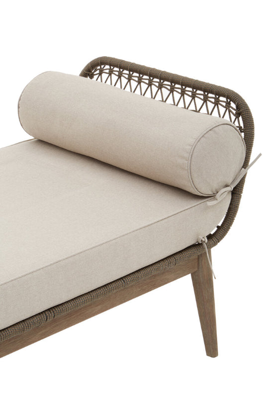 Beige cushioned bench with woven backrest on a white background