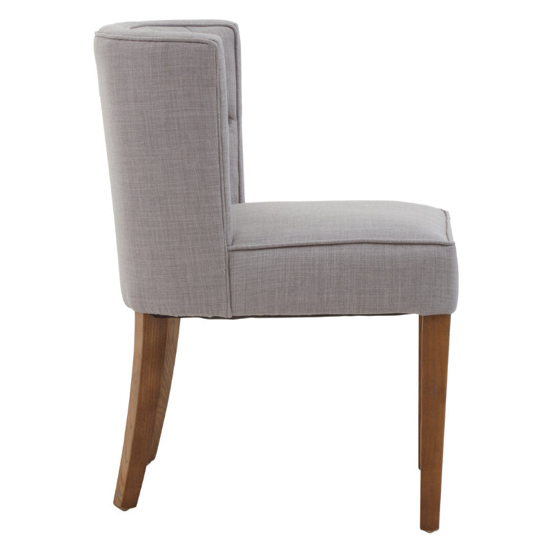Gray upholstered chair with wooden legs on a white background