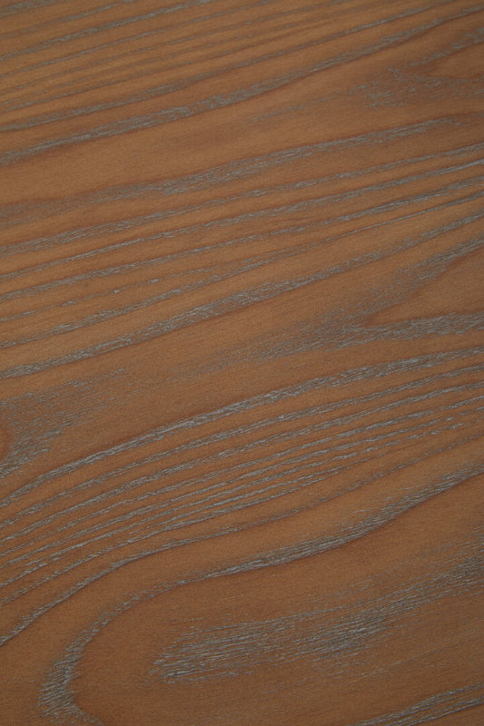 Close-up of a brown wooden surface with visible grain.