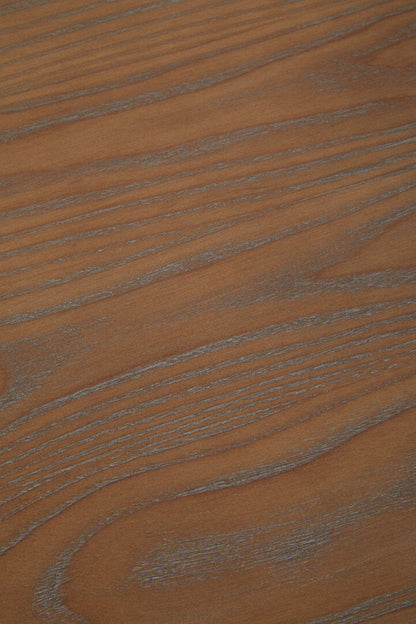 Close-up of a brown wooden surface with visible grain.