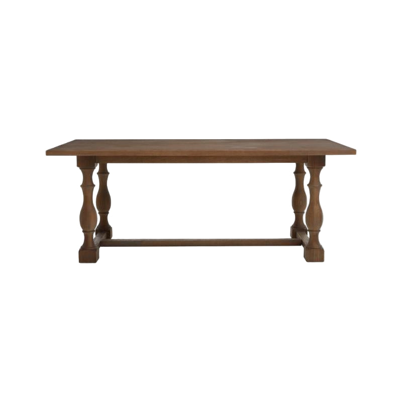 Wooden table with turned legs on a white background