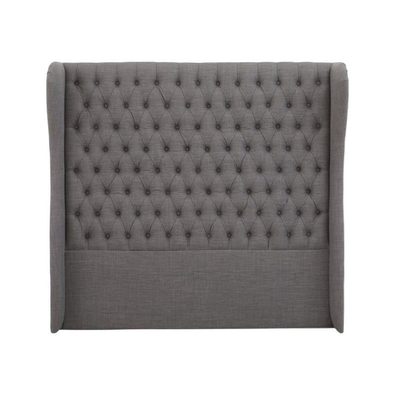 Gray tufted headboard on a white background