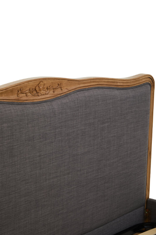 Gray upholstered headboard with wooden trim on a white background