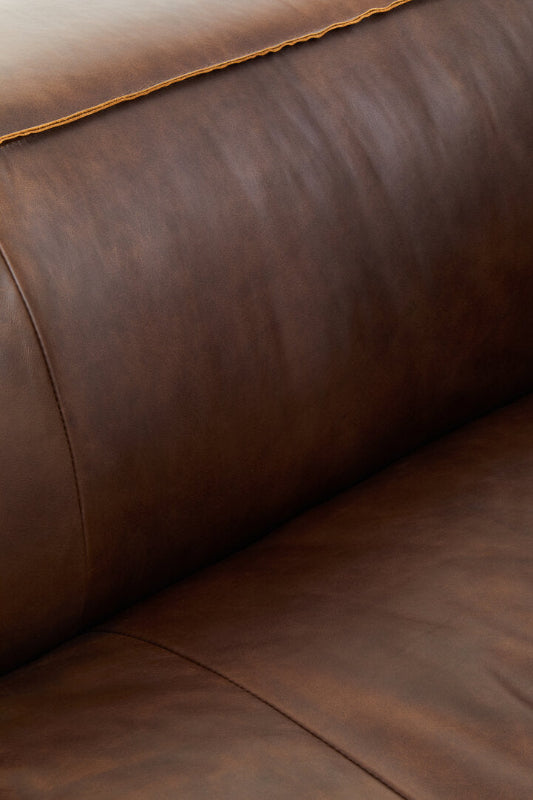 Close-up of a brown leather sofa