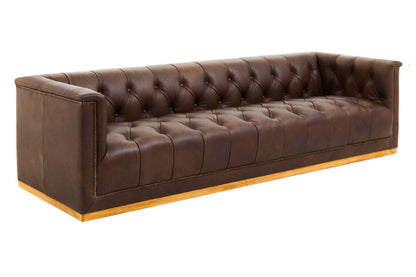 Brown leather sofa with tufted backrest on a white background