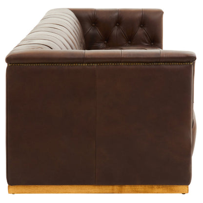 Brown leather sofa with tufted backrest on a white background